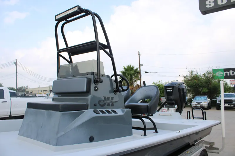 Slide: The Image of 2019 JH Performance Outlaw 230 boat with seating and steering console. - 17