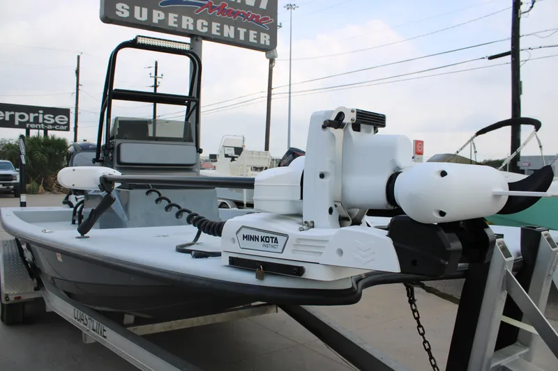 Slide: The Image of 2019 JH Performance Outlaw 230 boat with Minn Kota motor at a marine center. - 18