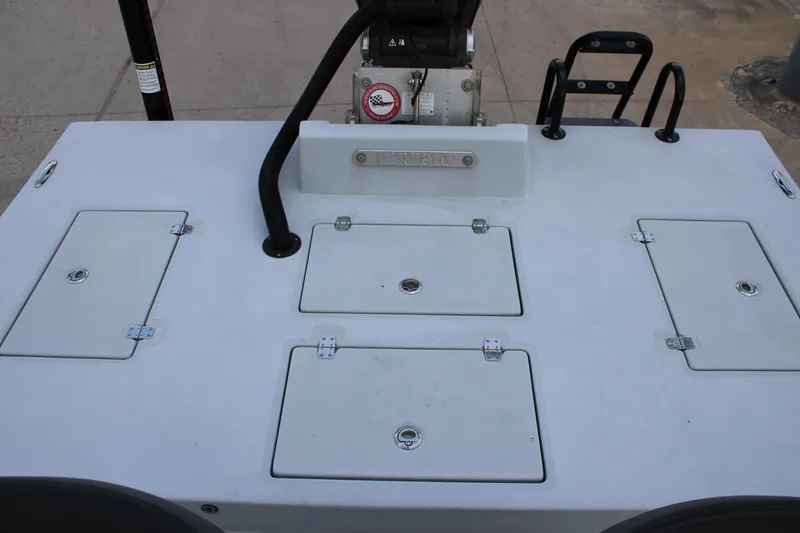 Slide: The Image of 2019 JH Performance Outlaw 230 boat deck with storage compartments and ladder. - 21
