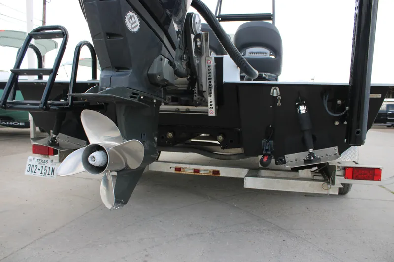 Slide: The Image of 2019 JH Performance Outlaw 230 boat rear view with propeller and trailer. - 3