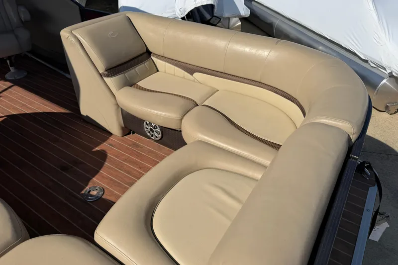 Slide: The Image of Luxurious seating on 2015 Crest Classic 230 SLC boat with wood-style flooring. - 13