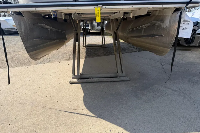 Slide: The Image of Underneath view of a 2015 Crest Classic 230 SLC pontoon boat on a trailer. - 16