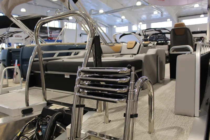 Slide: The Image of 2026 Avalon 2385 25 LSZ VRB pontoon boat interior with seating and chrome details. - 10