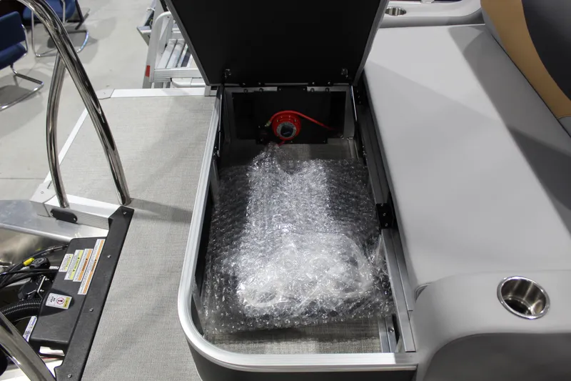 Slide: The Image of Storage compartment of 2026 Avalon 2385 25 LSZ VRB boat with bubble-wrapped item. - 19