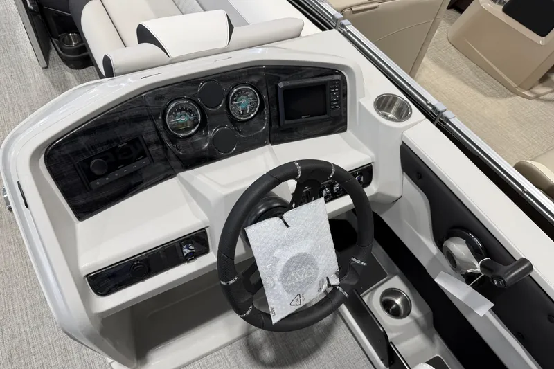 Slide: The Image of 2026 Avalon 2385 25 LSZ VRB boat dashboard with steering wheel and controls. - 5
