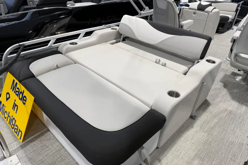 Slide: The Image of 2026 Avalon 2385 25 LSZ VRB boat interior with seating, "Made in Michigan" sign. - 7