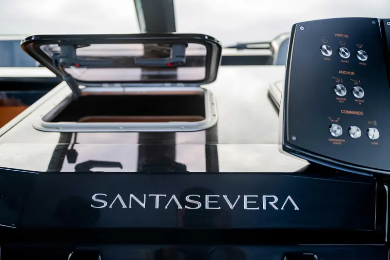Slide: The Image of 2026 Santasevera52 yacht control panel with open hatch and brand logo. - 17