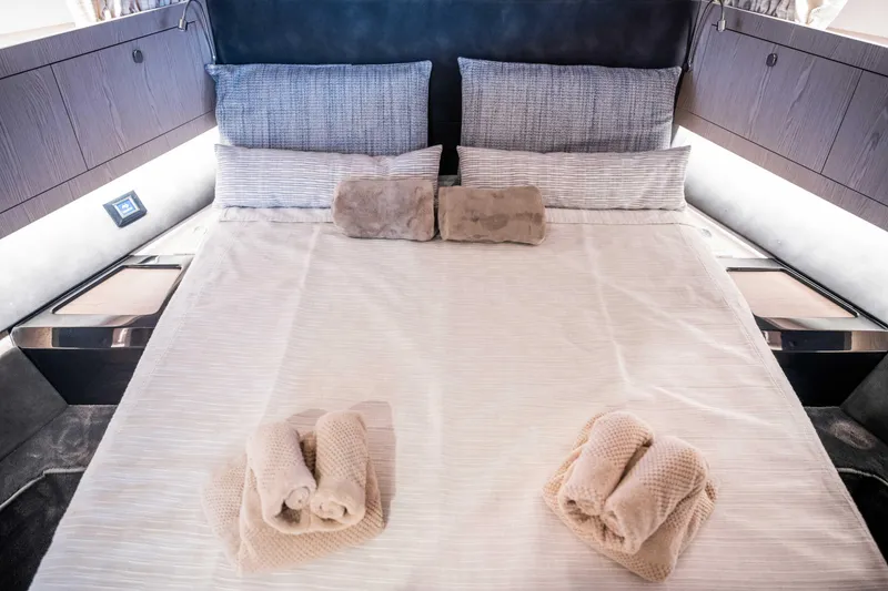 Slide: The Image of Luxurious Santasevera52 2026 yacht bedroom with neatly arranged bed and soft towels. - 19
