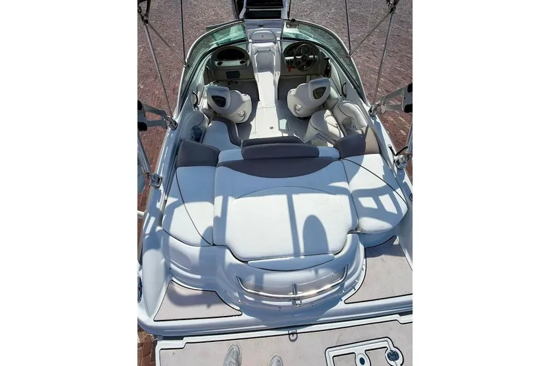 Slide: The Image of 2005 Crownline 216 LS boat interior with white seating and steering wheel. - 12