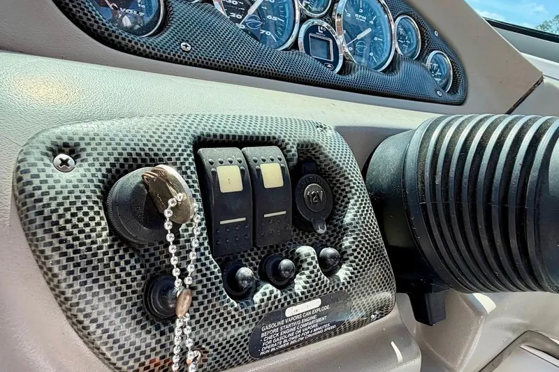 Slide: The Image of Dashboard of a 2005 Crownline 216 LS boat with gauges and controls. - 22