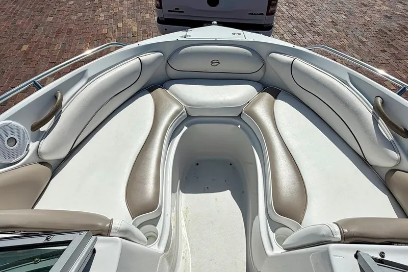 Slide: The Image of 2005 Crownline 216 LS boat interior with cushioned seating and speaker system. - 25