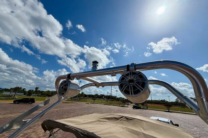 Slide: The Image of 2005 Crownline 216 LS boat speakers under a clear blue sky. - 28