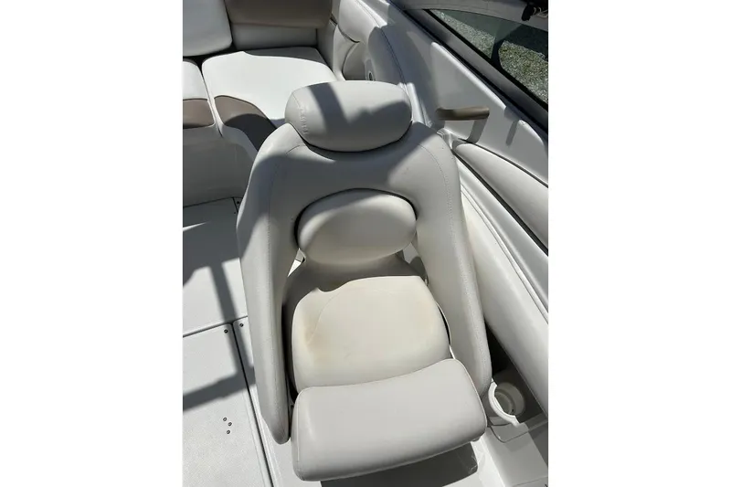 Slide: The Image of 2005 Crownline 216 LS boat interior with white cushioned seating. - 31