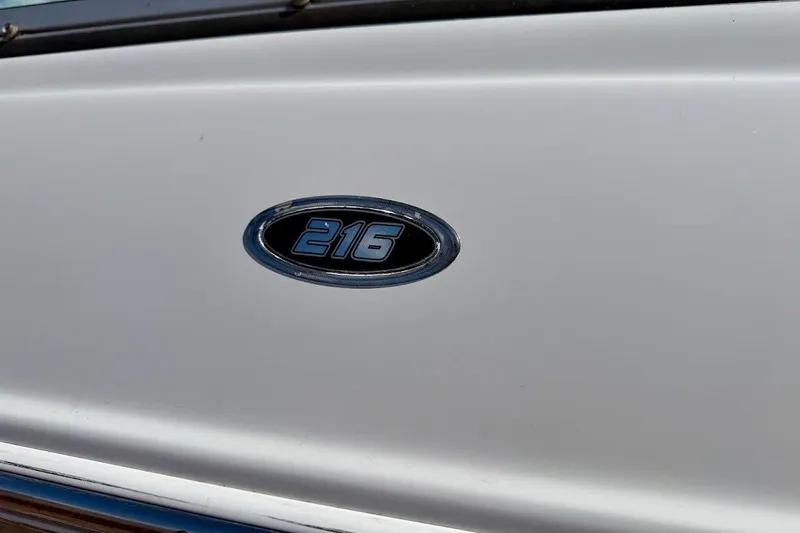 Slide: The Image of Close-up of 2005 Crownline 216 LS boat emblem on white surface. - 8