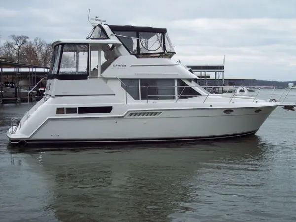 The Image of 1998 Carver 355 Aft Cabin Motor Yacht on calm water. - 1