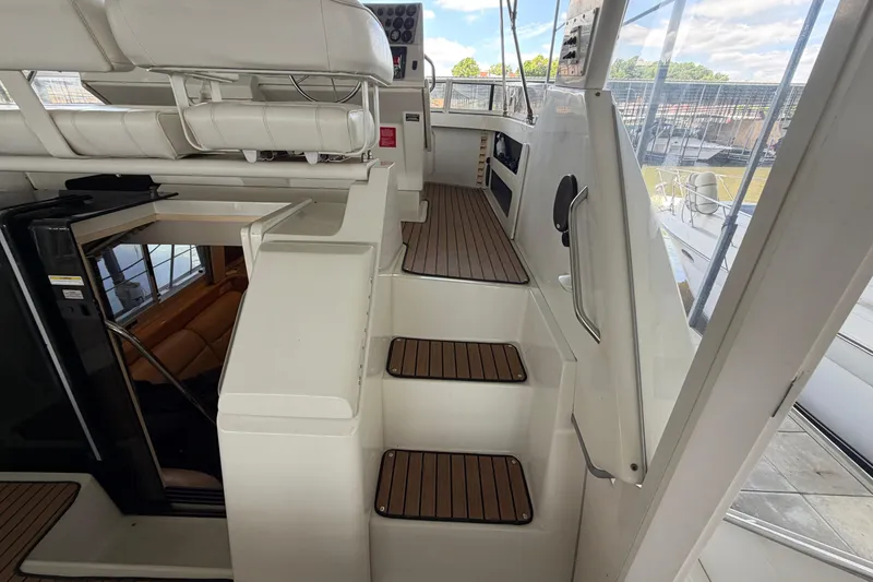 Slide: The Image of 1998 Carver 355 Aft Cabin Motor Yacht interior with steps and seating area. - 10