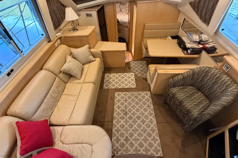 Slide: The Image of Interior of 1998 Carver 355 Aft Cabin Motor Yacht with cozy seating and elegant decor. - 15