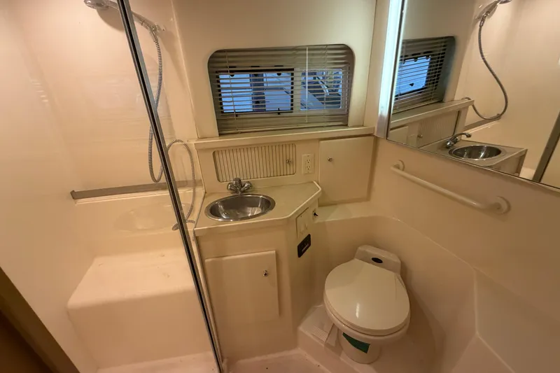 Slide: The Image of Bathroom interior of 1998 Carver 355 Aft Cabin Motor Yacht with sink and toilet. - 27