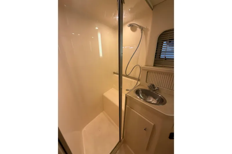 Slide: The Image of 1998 Carver 355 Aft Cabin Motor Yacht bathroom with shower and sink. - 28