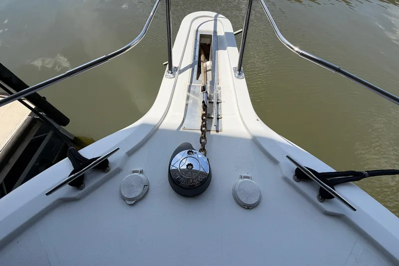 Slide: The Image of Bow of 1998 Carver 355 Aft Cabin Motor Yacht with anchor chain and cleats. - 7