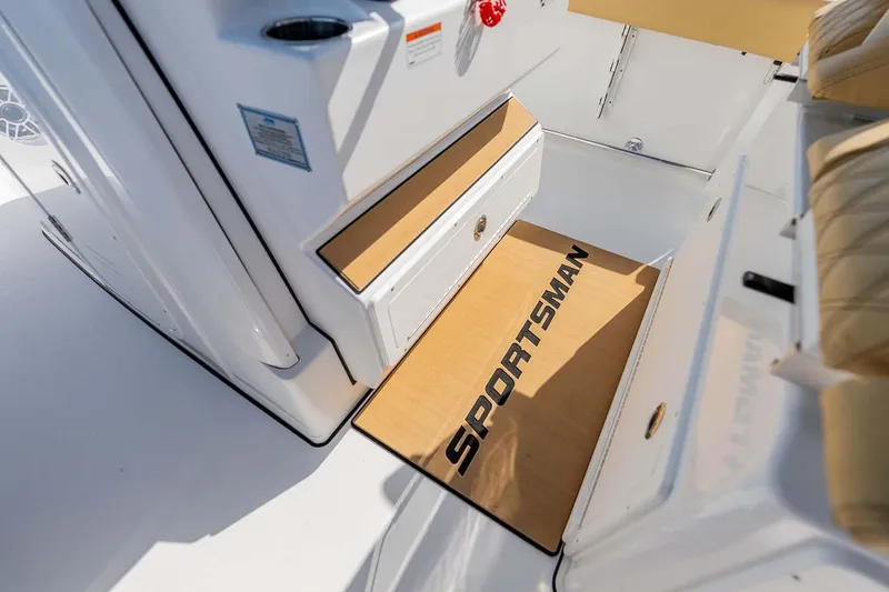 Slide: The Image of Manufacturer Provided Image: 2025 Sportsman Heritage 261 Center Console interior with branded mat and storage. - 20