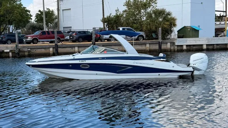 The Image of 2023 Crownline Eclipse E285 XS boat on calm water. - 0