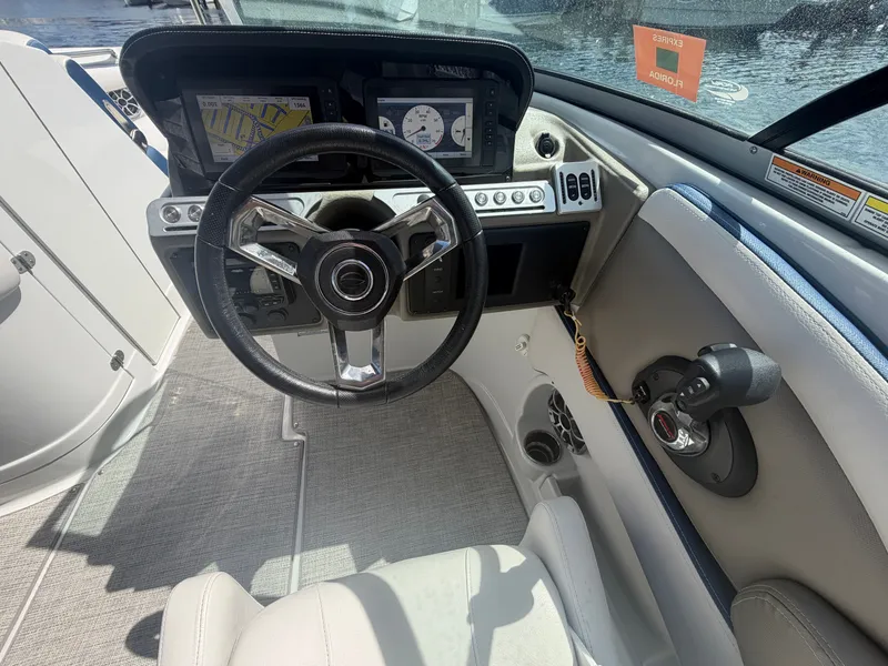 Slide: The Image of Interior view of 2023 Crownline Eclipse E285 XS cockpit. - 14