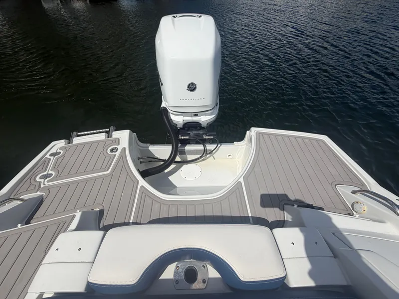 Slide: The Image of Rear view of 2023 Crownline Eclipse E285 XS boat on water. - 18