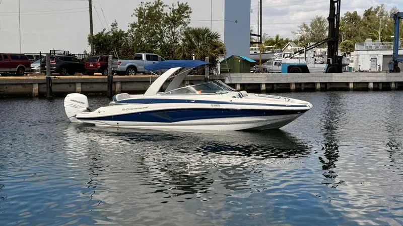 Slide: The Image of 2023 Crownline Eclipse E285 XS boat on the water. - 3