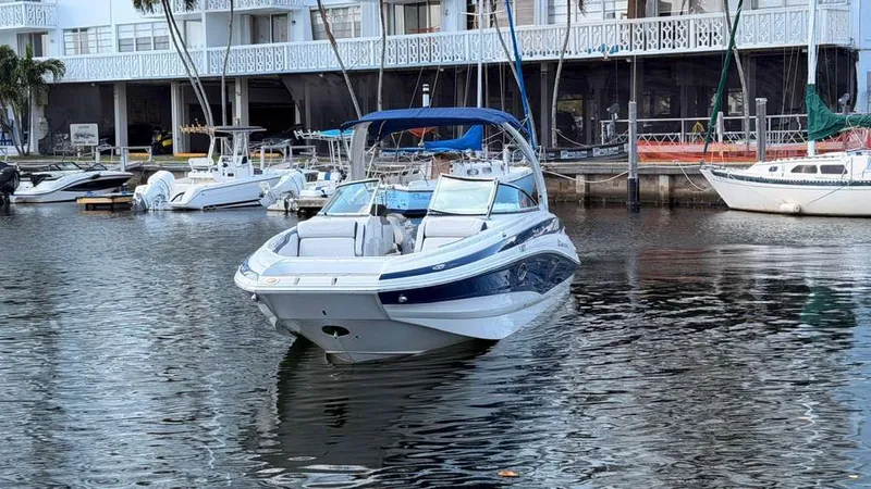 Slide: The Image of 2023 Crownline Eclipse E285 XS boat docked in marina. - 4