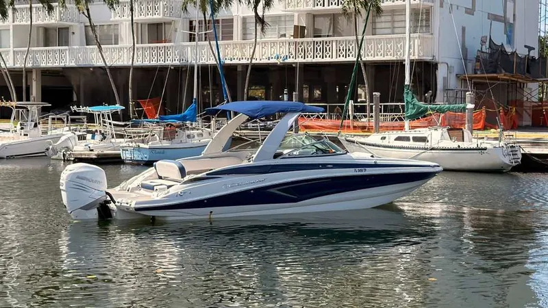 Slide: The Image of 2023 Crownline Eclipse E285 XS boat docked in harbor. - 6