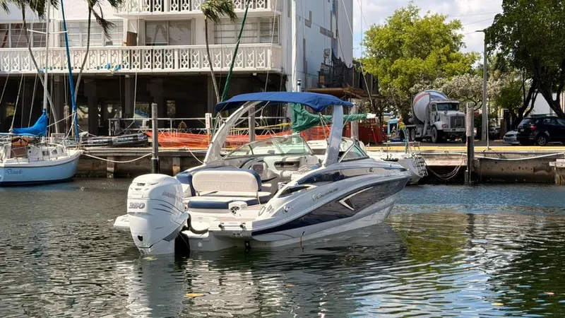 Slide: The Image of 2023 Crownline Eclipse E285 XS boat docked at marina. - 7