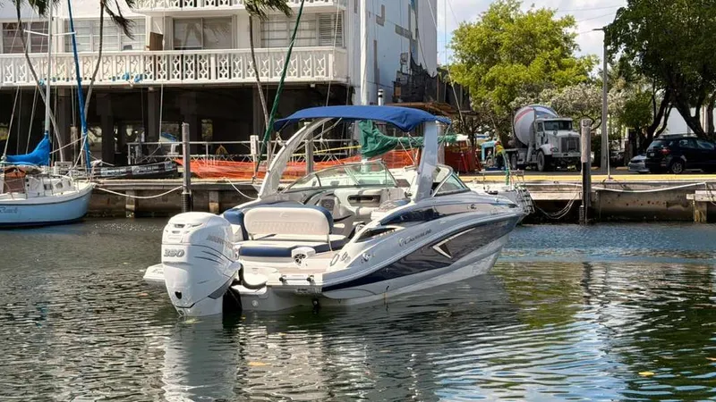 Slide: The Image of 2023 Crownline Eclipse E285 XS boat docked at marina. - 8