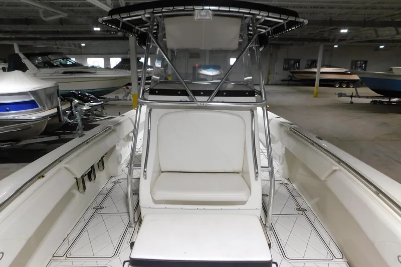 Slide: The Image of 2005 Fountain 34 Center Console boat interior in a storage facility. - 12