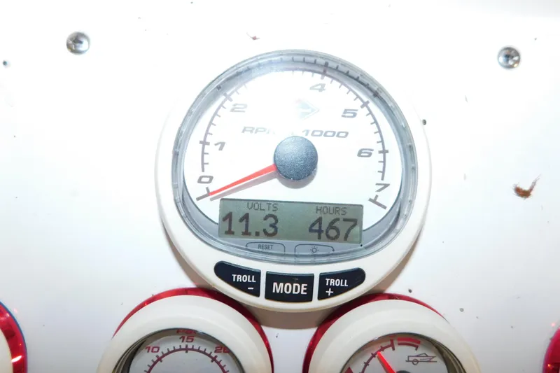 Slide: The Image of Close-up of a 2005 Fountain 34 Center Console gauge showing 11.3 volts and 467 hours. - 22