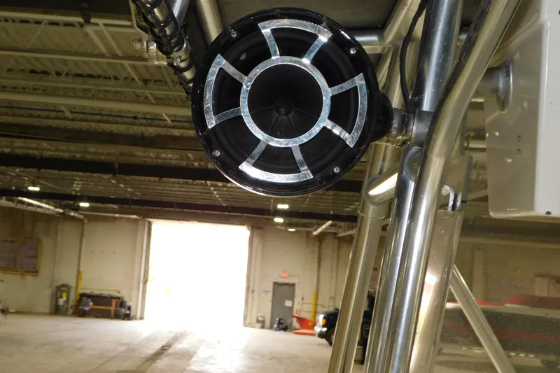 Slide: The Image of Close-up of a speaker on a 2005 Fountain 34 Center Console boat in a warehouse. - 28