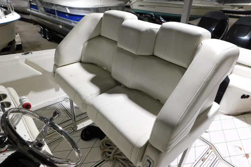 Slide: The Image of White leather seating on a 2005 Fountain 34 Center Console boat. - 29