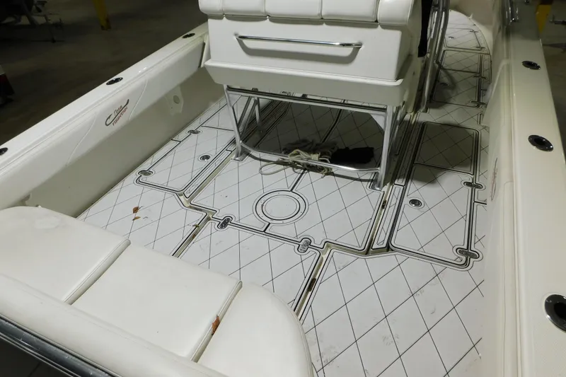Slide: The Image of 2005 Fountain 34 Center Console boat interior with custom flooring and seating. - 34