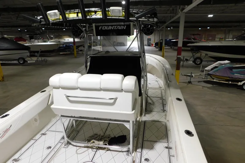 Slide: The Image of 2005 Fountain 34 Center Console boat in indoor storage facility. - 35