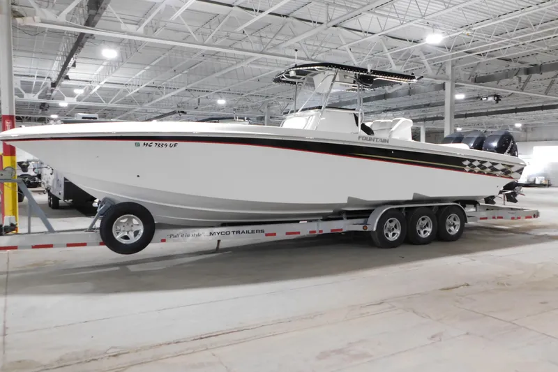 Slide: The Image of 2005 Fountain 34 Center Console boat on trailer in indoor storage facility. - 4