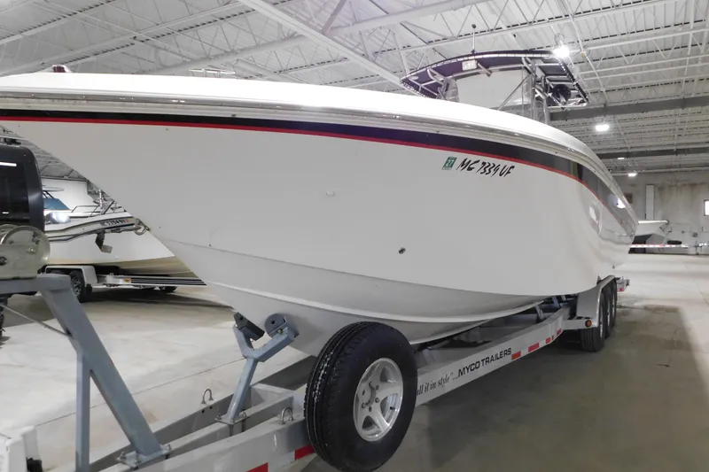 Slide: The Image of 2005 Fountain 34 Center Console boat on trailer in indoor storage facility. - 5