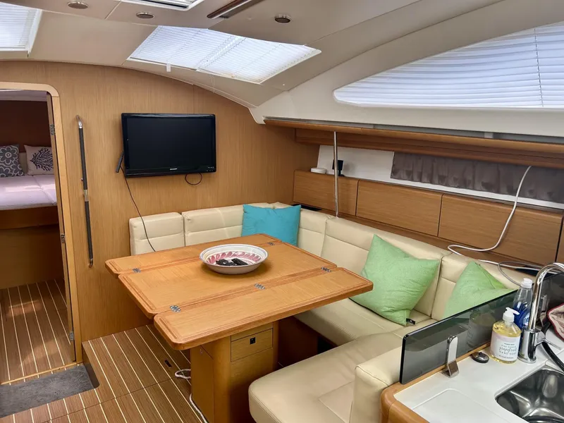 Slide: The Image of Interior of 2012 Jeanneau 50 DS yacht with cozy seating and modern amenities. - 21