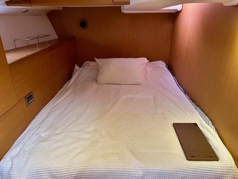 Slide: The Image of Cozy cabin interior of 2012 Jeanneau 50 DS sailboat with comfortable bedding. - 31