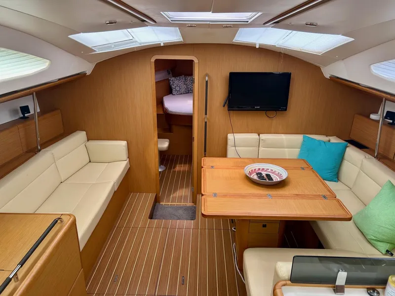 Slide: The Image of Interior of 2012 Jeanneau 50 DS yacht with cozy seating and modern amenities. - 4