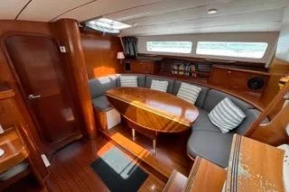 Slide: The Image of 1997 Beneteau Oceanis 40 CC sailboat docked, featuring a clean white deck and Edisto Island, SC marking. - 10