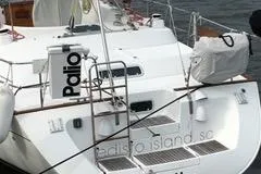 Slide: The Image of 1997 Beneteau Oceanis 40 CC sailboat docked near urban waterfront buildings. - 2