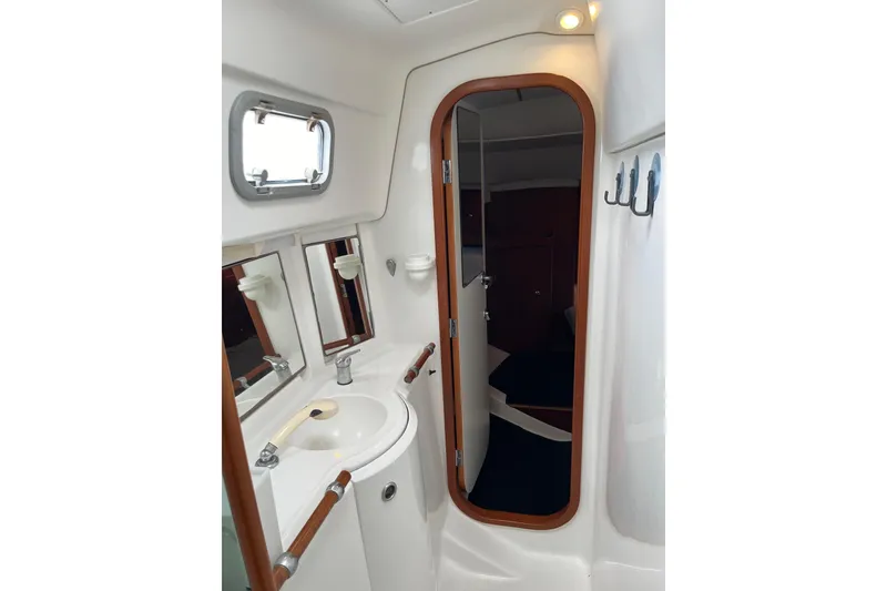 Slide: The Image of Interior of 1997 Beneteau Oceanis 40 CC with sink and mirror. - 21
