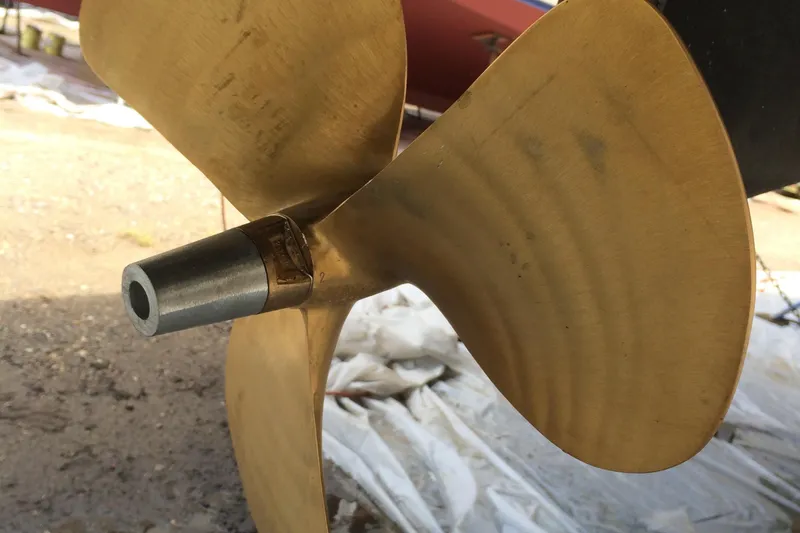 Slide: The Image of Close-up of a brass propeller on a 1997 Beneteau Oceanis 40 CC sailboat. - 26