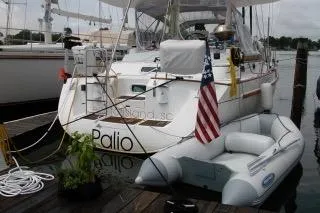 Slide: The Image of 1997 Beneteau Oceanis 40 CC yacht docked at marina, featuring sleek design and spacious deck. - 4