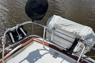 Slide: The Image of Bow view of 1997 Beneteau Oceanis 40 CC sailboat with anchor chain and railing. - 7